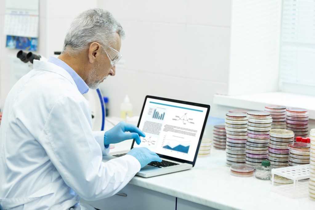 Scientist typing research article